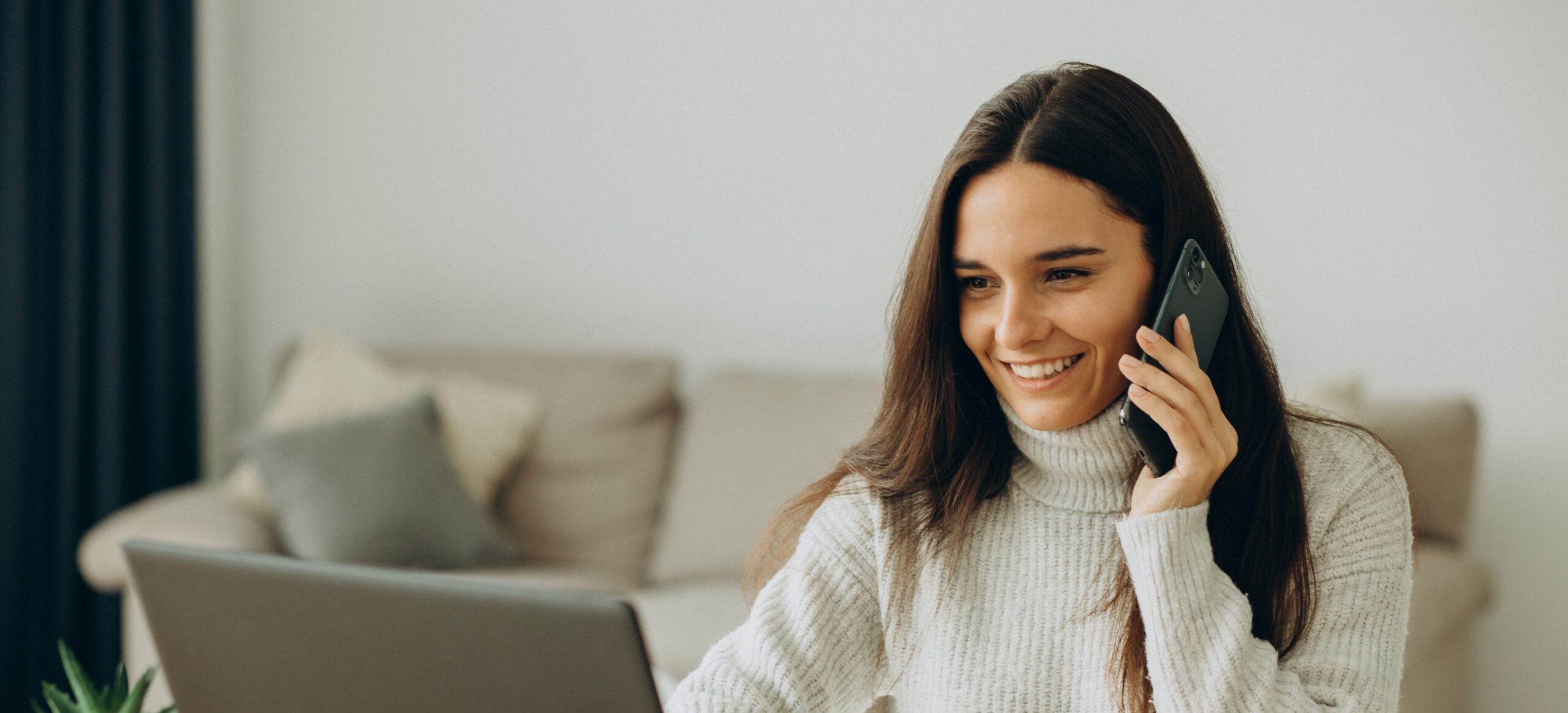 Woman working on computer from home